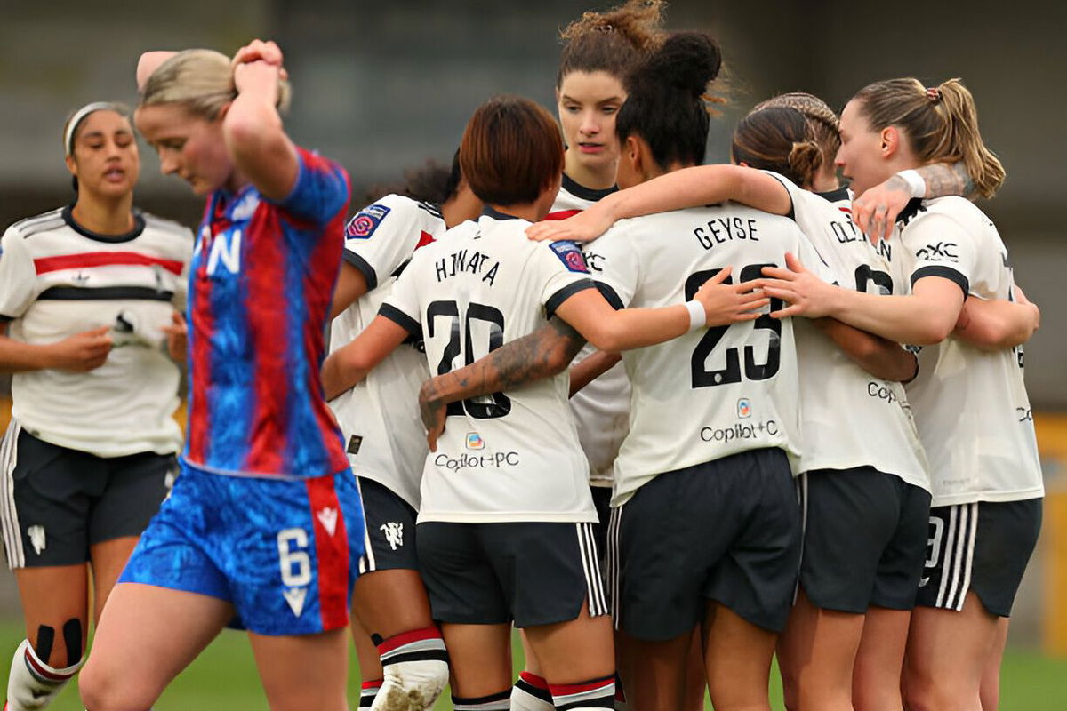 Manchester United players celebrate after Grace Clinton scored her side's opening goal during the Barclays Women's Super League match between Crystal Palace and Manchester United at VBS Community Stadium on December 15, 2024 in Sutton, England.