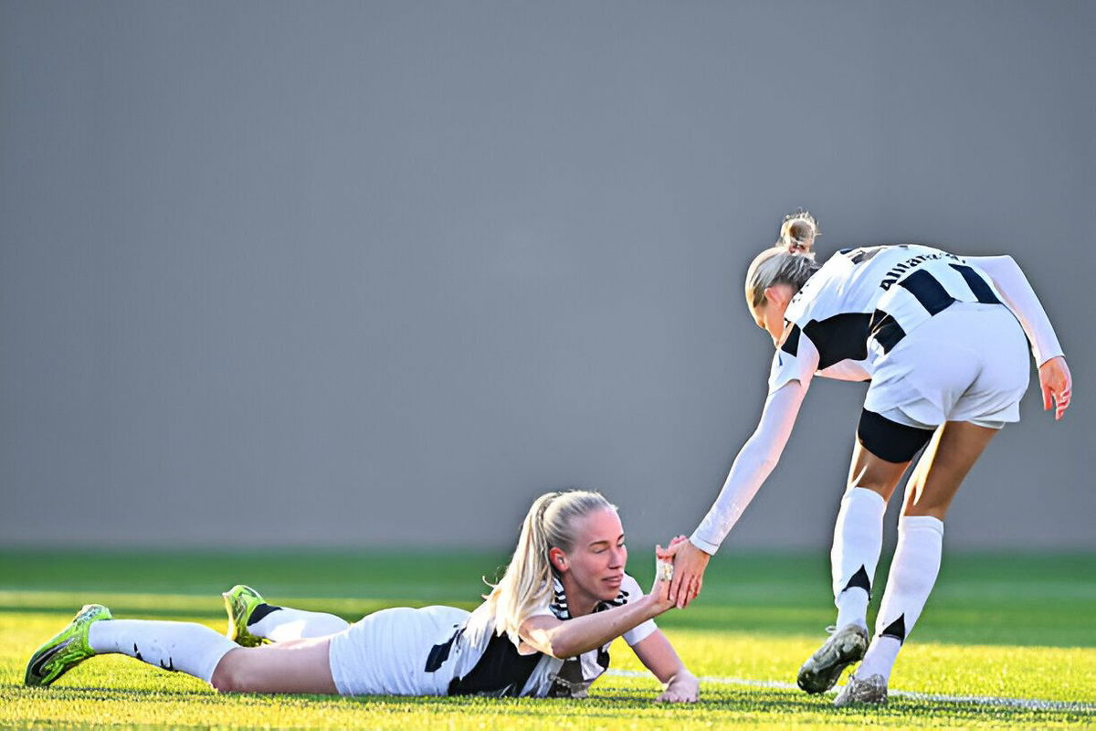 Emma Kullberg of Juventus (right) comforts her team-mate Amalie Vangsgaard during the Women Serie A match between Fiorentina and Juventus at Viola Park on December 15, 2024 in Florence, Italy.