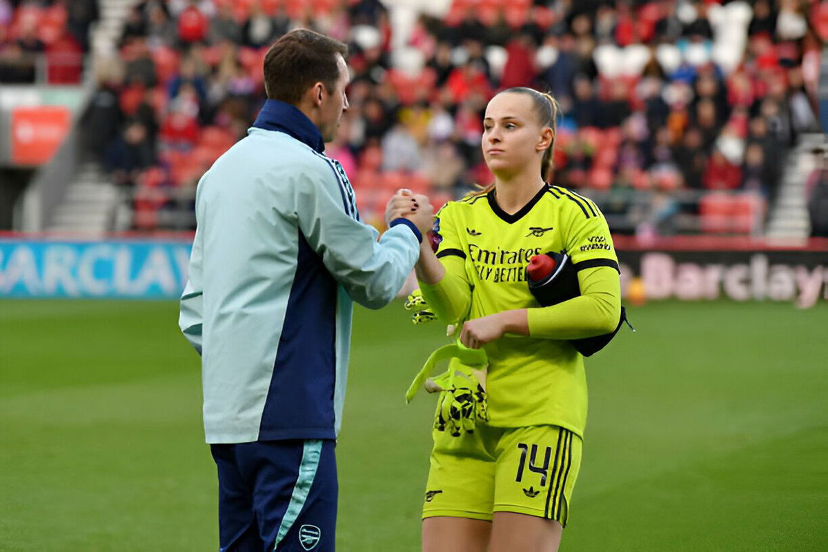 Daphne van Domselaar of Arsenal interacts with Seb Barton